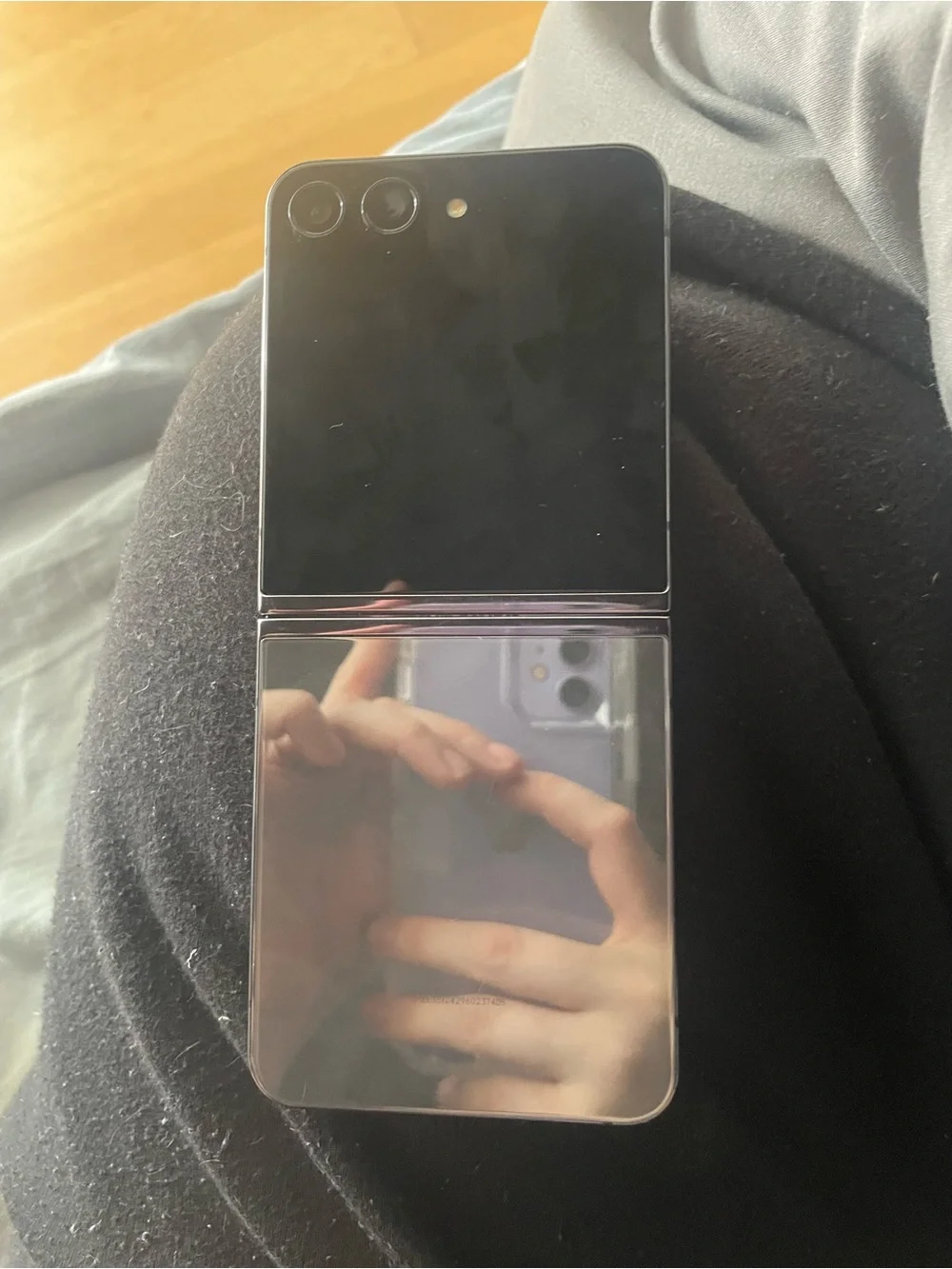 Phone (foldable) photographed — likely not a computer accessory